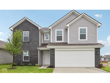 Charming two-story home with gray siding, a black brick facade, and an attached two-car garage at 10416 Crystal Coop Ln, Indianapolis, IN 46235