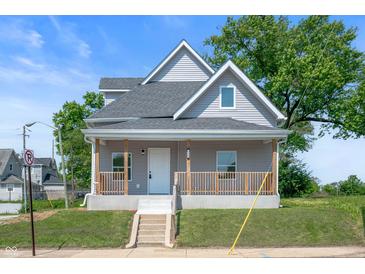 Charming two-story home with a welcoming front porch and well-maintained landscaping at 2170 S East St, Indianapolis, IN 46225