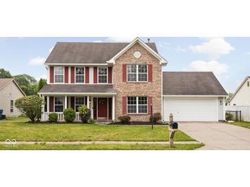 Charming brick two-story home with a well-manicured lawn and lovely red shutters at 6955 Long Run Dr, Indianapolis, IN 46268