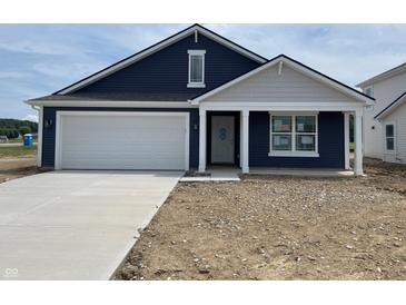 Charming one-story home with navy siding, white trim, a concrete driveway and an attached two-car garage at 1175 Mcbride St, Greenfield, IN 46140