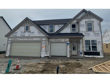 Two-story home featuring an attached garage, covered in Tyvek, and is currently under construction at 19976 Stone Side Dr, Westfield, IN 46074