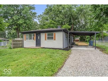 Charming one-story home with gray brick, wood shutters, and a convenient carport at 360 Richie Ave, Indianapolis, IN 46234