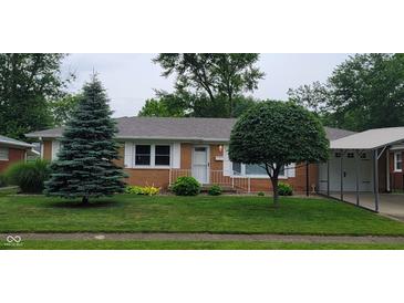 Charming single-story brick home featuring a well-maintained lawn and mature trees at 420 Brookside Ln, Plainfield, IN 46168
