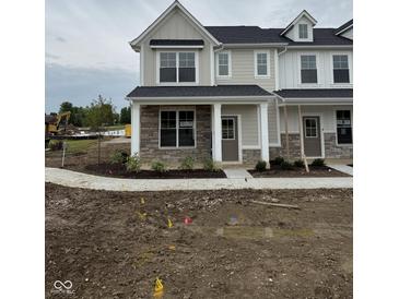 Charming two-story home features stone accents, modern design, and a welcoming entryway at 8568 Goldfinch Rd, Brownsburg, IN 46112