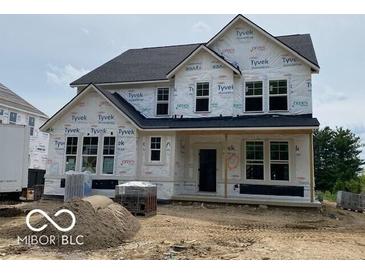New two-story home featuring a modern architectural style and bright, plentiful windows at 12592 Lowery Way, Fishers, IN 46037