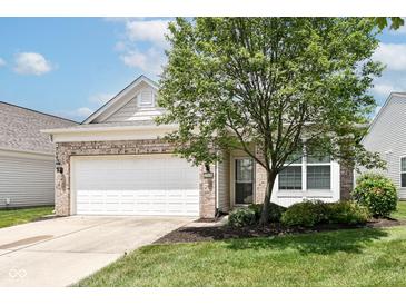 Charming single-Gathering home with a brick facade, a well-maintained lawn, and a two-car garage at 15946 Marsala Dr, Fishers, IN 46037