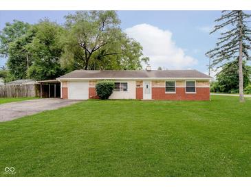 Charming one story home with attached garage, carport, and well maintained lawn at 4514 Priscilla Ave, Indianapolis, IN 46226