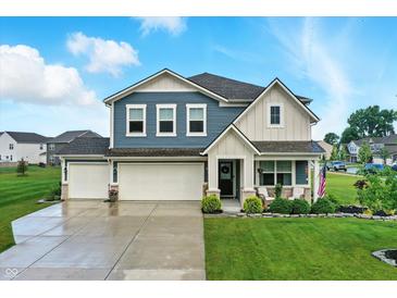 Charming two-story home with three-car garage and beautiful landscaping, perfect for curb appeal at 8547 Winton Pl, Pendleton, IN 46064