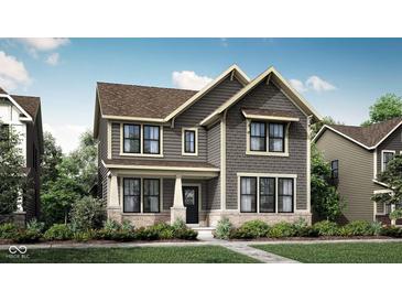Charming two-story home with detailed architectural design and welcoming front porch at 13646 Grand Abbey Way, Fishers, IN 46037
