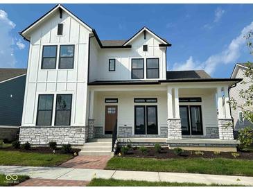 Modern two-story home with white siding, black trim, and stone accents on the porch columns at 20005 Gansett Rd, Westfield, IN 46074