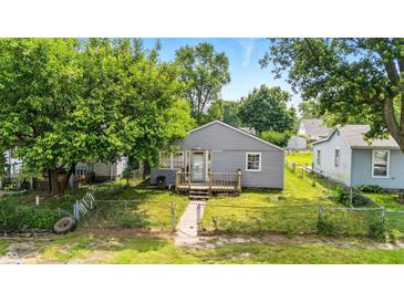 Charming gray home with a cozy front porch and a well-maintained lawn at 3251 Mars Hill St, Indianapolis, IN 46221
