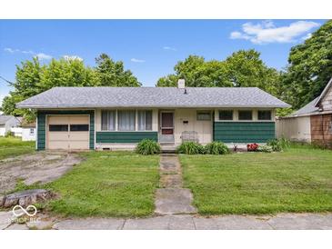 Charming single-story home with a well-maintained lawn and landscaping in a suburban neighborhood at 414 S Green St, Brownsburg, IN 46112