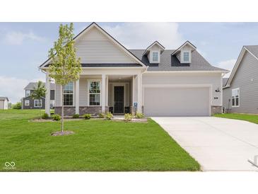Charming new construction home with a manicured lawn and a two-car attached garage at 5673 Stetson Dr, Whitestown, IN 46052