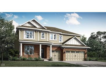 Charming two-story home featuring a brick and siding exterior and an attached two-car garage at 15436 Manderley St, Fishers, IN 46040