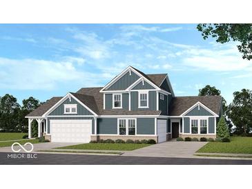 Charming two-story home with a mix of brick and siding, a two-car garage, and a well-maintained lawn at 2169 Aviary Ln, Danville, IN 46122
