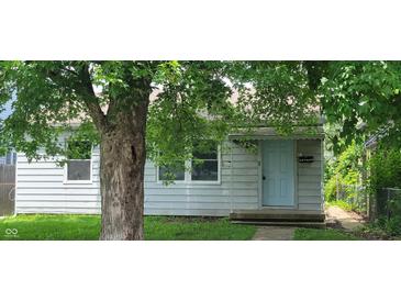 Charming single-Gathering home with a light blue door and a well-maintained lawn at 5344 Fletcher Ave, Indianapolis, IN 46219