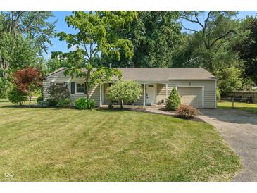 Charming single-story home with a well-maintained lawn and mature trees at 2906 E 65Th St, Indianapolis, IN 46220