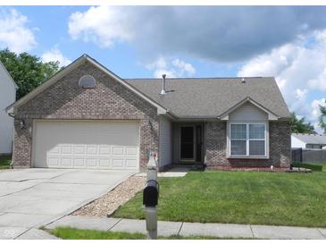 Charming single-story brick home featuring an attached garage, well-maintained lawn, and inviting curb appeal at 10178 Cornith Way, Avon, IN 46123