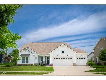 Charming single-Gathering home boasting a three car garage, manicured lawn, and beautiful landscaping at 5294 Lndg Pl Ln, Noblesville, IN 46062