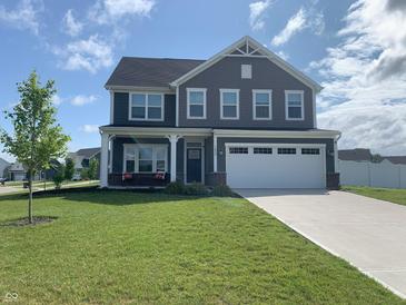 Charming two-story home with gray siding, white trim, a two-car garage, and a well-manicured lawn at 7270 W Stone Pass, New Palestine, IN 46163