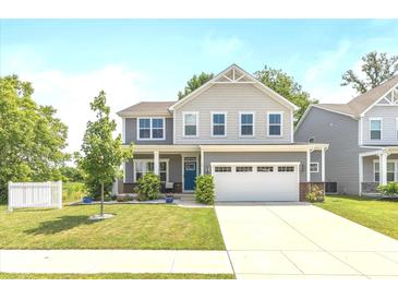 Charming two-story home featuring a well-manicured lawn and attached two-car garage at 265 Gathering Ln, Greenwood, IN 46143