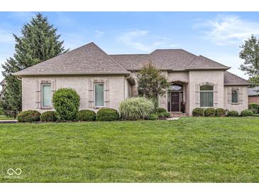 Charming single-story home with a brick facade, arched entryway, and well-manicured front lawn at 2920 Bloomsbury S, Greenwood, IN 46143