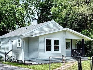 Charming home featuring light siding, a cozy front porch, and well-maintained landscaping at 3712 S Kealing S Ave, Indianapolis, IN 46237