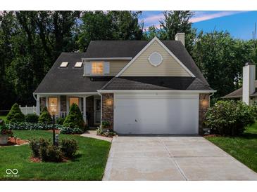 Charming home with a two-car garage, well-manicured lawn, and inviting curb appeal at 6439 Bower Dr, Indianapolis, IN 46241