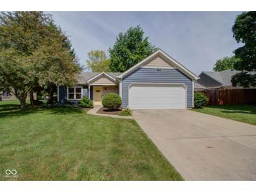 Charming single-Gathering home with blue siding, a two-car garage, and a well-manicured front yard at 9170 Andiron Way, Indianapolis, IN 46250