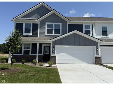 Charming two-story home with gray siding, white trim, a two-car garage, and a well-maintained front lawn at 2954 Grand Rdg Dr, Greenwood, IN 46143