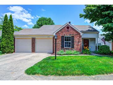 Charming brick home featuring a two-car garage and well-maintained front yard at 6740 Sundown S Dr, Indianapolis, IN 46254