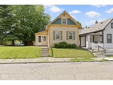 Charming home with well-kept lawn and inviting entrance, perfect for a starter Gathering at 29 E Caven St, Indianapolis, IN 46225