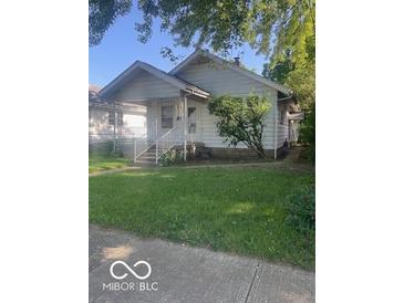 Charming single-story home with a welcoming front porch and well-maintained lawn at 416 W 21St St, Anderson, IN 46016
