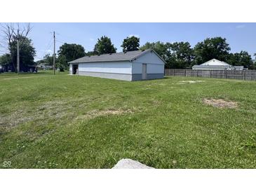 Exterior shot of home with nice yard, trees, and blue skies at 4503 W Minnesota St, Indianapolis, IN 46241