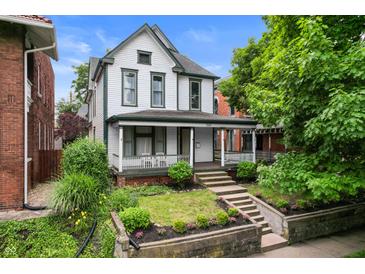 Charming two-story home with inviting front porch at 545 Fletcher Ave, Indianapolis, IN 46203