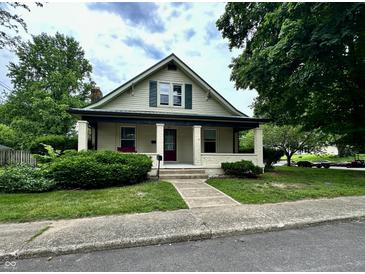 Charming two-story home with a covered front porch, landscaped yard, and inviting curb appeal at 388 N Ohio St, Martinsville, IN 46151