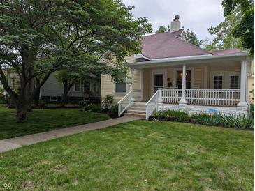 Charming single Gathering home featuring a lovely lawn and covered front porch at 414 E Main St, Plainfield, IN 46168