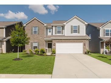 Charming two-story home with a brick and siding exterior, well-maintained lawn, and an attached two-car garage at 5809 Terracotta Trce, McCordsville, IN 46055