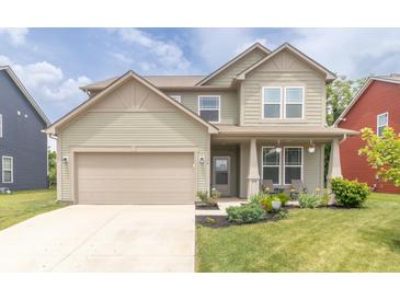 Charming two-story home featuring an attached garage and a well-maintained front yard at 1156 Brockton Ct, Greenfield, IN 46140