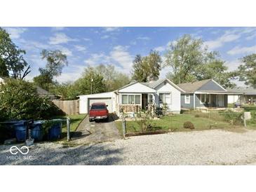 Charming single story home with a driveway and a detached garage in a residential neighborhood at 2638 S Mcclure St, Indianapolis, IN 46241