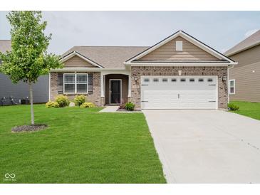 Charming single-Gathering home featuring a manicured lawn and attached two car garage at 6644 Aberdeen Dr, McCordsville, IN 46055