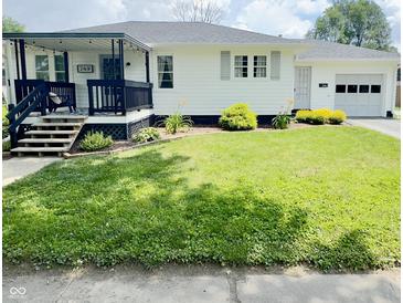 Charming single-story home with a well-maintained lawn and inviting front porch with a nice railing at 249 N Mill St, Plainfield, IN 46168