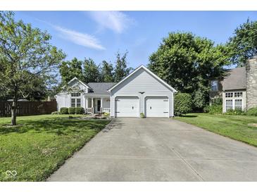 Charming single-Gathering home featuring a two-car garage, manicured lawn, and traditional architecture at 8929 Sunburst Cir, Indianapolis, IN 46227