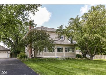 Charming two-story home with mature trees and a well-manicured lawn offering great curb appeal at 1325 Fordice Rd, Lebanon, IN 46052