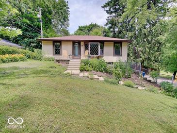 Charming single-story home features a well-maintained yard and inviting front entrance at 1908 W Northgate St, Indianapolis, IN 46228