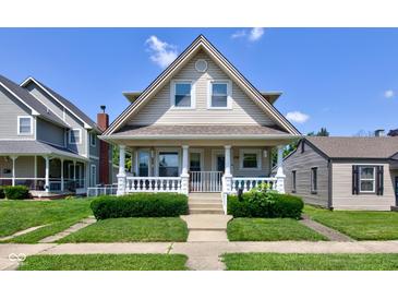 Charming two-story home featuring a classic porch, well-maintained lawn, and inviting curb appeal at 238 S 5Th Ave, Beech Grove, IN 46107