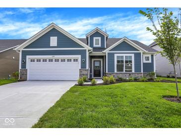 Charming blue home with a white garage door, stone accents, and a well-manicured lawn at 7195 Rose Hill Ave, Brownsburg, IN 46112
