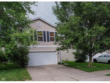 Charming two-story home featuring a two-car garage and well-maintained landscaping at 2355 Collins Way, Greenfield, IN 46140