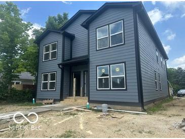 New construction two-story home featuring gray siding and black trim, with large windows at 2875 N Dearborn St, Indianapolis, IN 46218