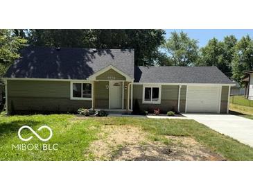 Charming single-story home with manicured front yard and attached one car garage at 7529 N Green Meadows, Fairland, IN 46126